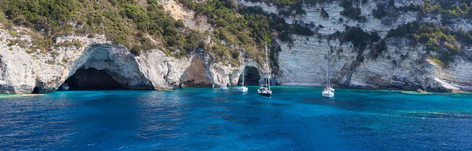 a photo from a place in Paxos island in Corfu Greece from blue caves.